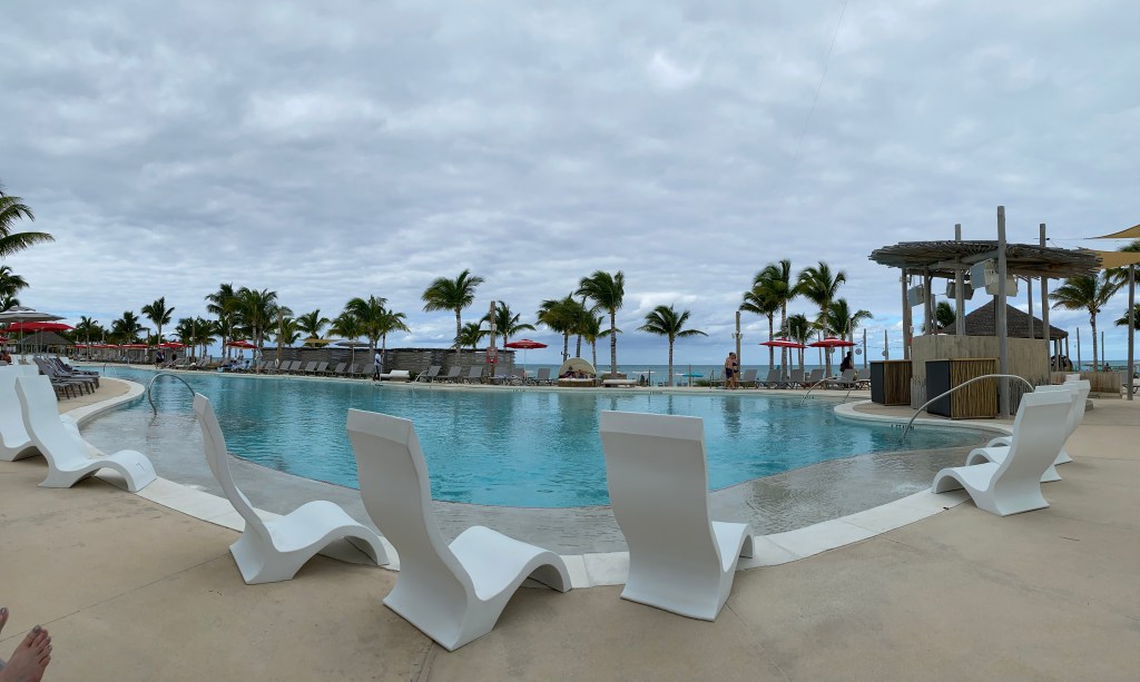 Swimming pool with lounge chairs located at The Bimini Beach Club in the Bahamas.
